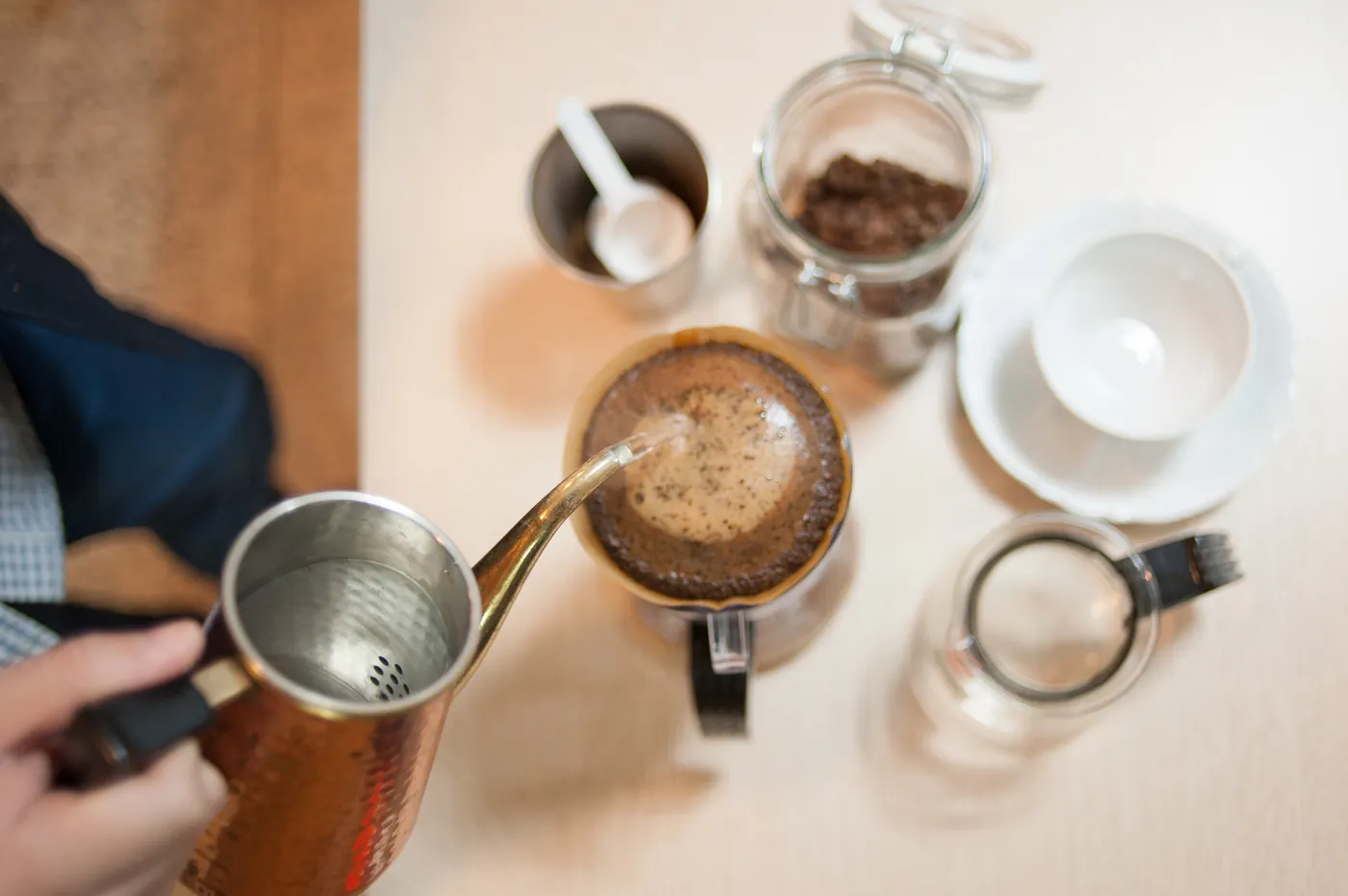 A beginner-friendly espresso machine on a kitchen counter, pulling a shot